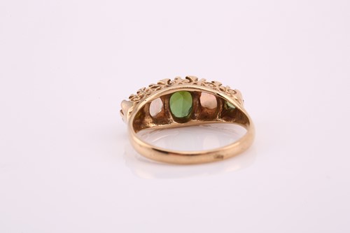 Lot 23 - A tourmaline and opal dress ring, comprises a...