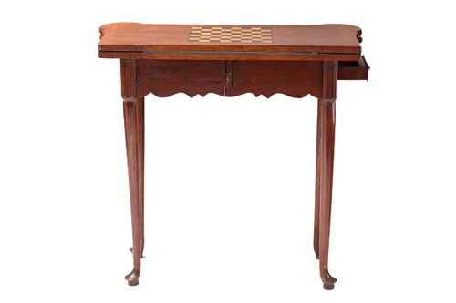Lot 277 - A George III style oak fold-over gaming table...