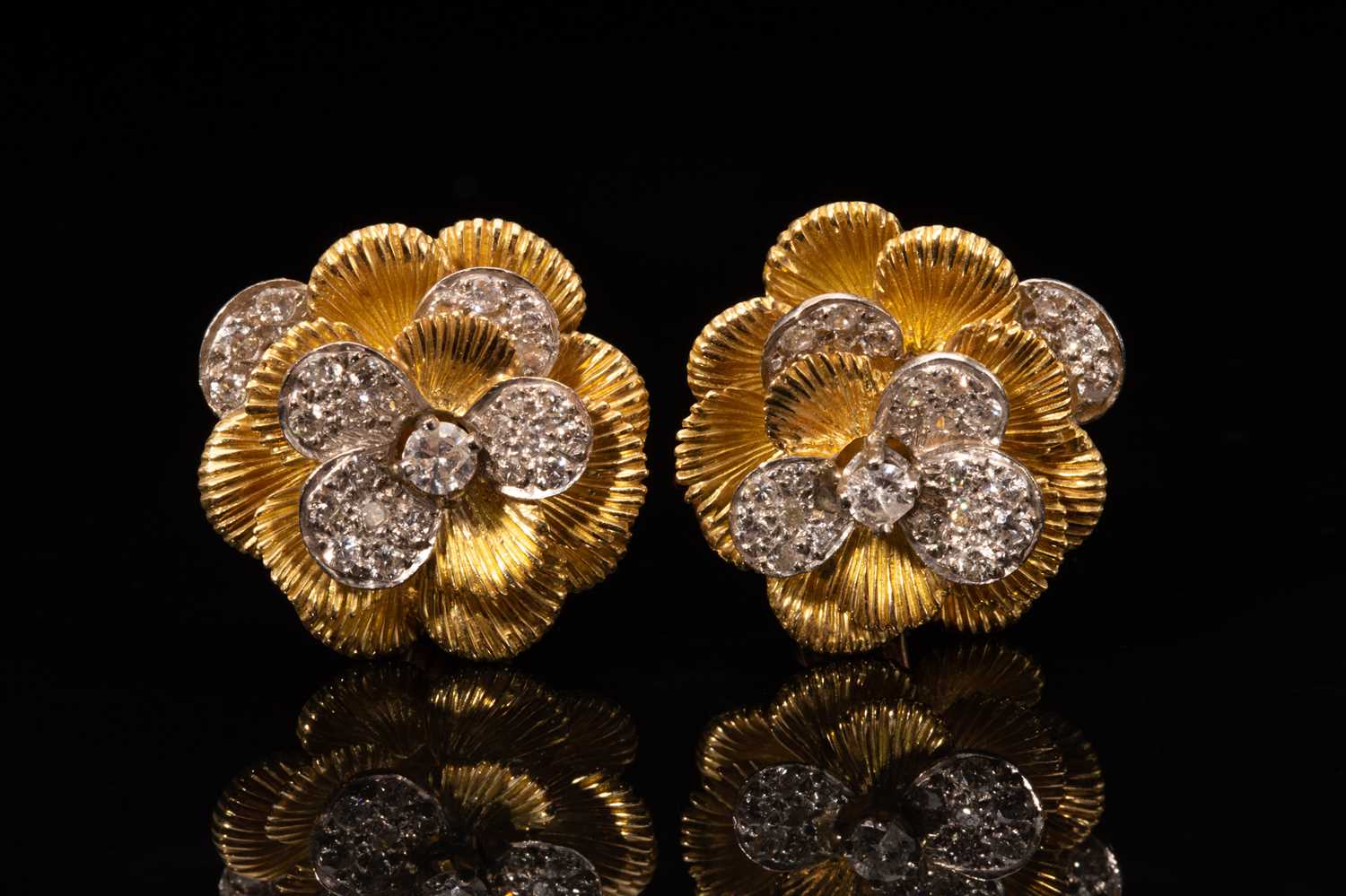 Lot 45 - A pair of Kutchinsky platinum and 18ct yellow...