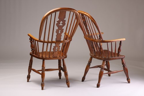 Lot 230 - A 19th century Windsor high hoop back elm and...