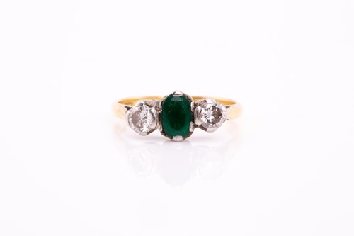 Lot 299 - An emerald and diamond half hoop ring; the...