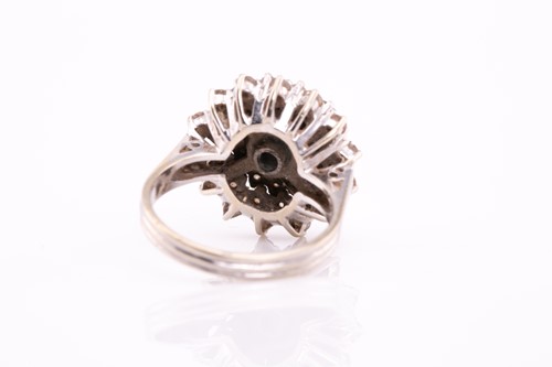 Lot 28 - A diamond cluster dress ring; the four tiers...