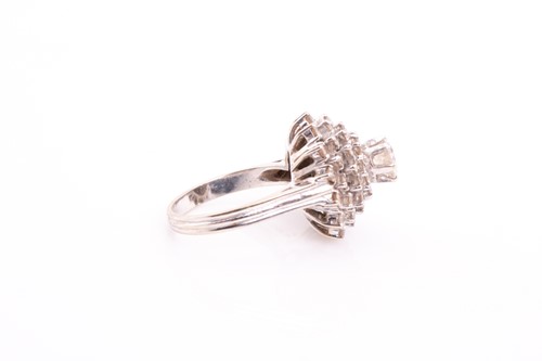 Lot 28 - A diamond cluster dress ring; the four tiers...