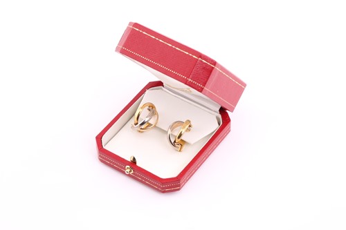 Lot 82 - A pair of Cartier tri-coloured earrings, each...