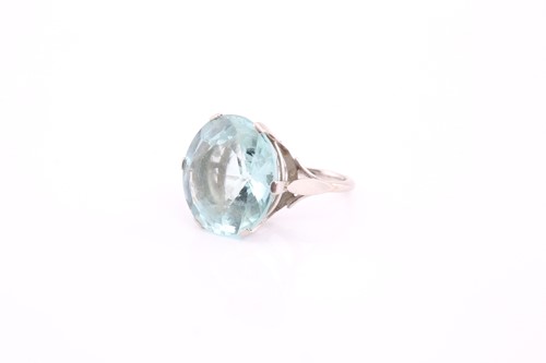 Lot 152 - An aquamarine ring, comprises a round mix-cut...