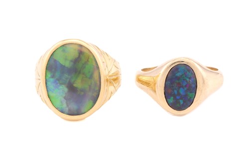 Lot 214 - Two opal rings, one comprises an oval precious...