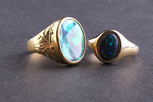 Lot 214 - Two opal rings, one comprises an oval precious...