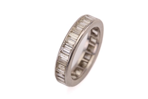 Lot 259 - A diamond eternity ring, comprises...