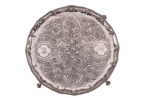 Lot 467 - A George III silver salver; shaped circular...