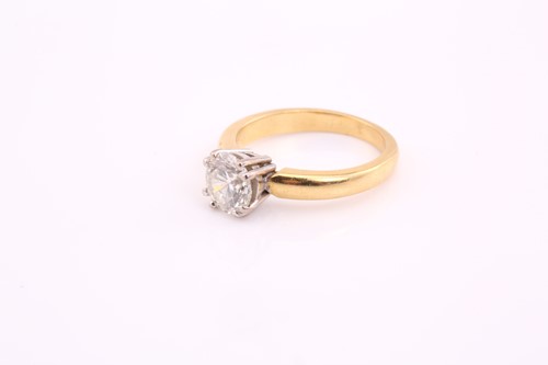 Lot 60 - An 18ct gold diamond solitaire ring, with a...