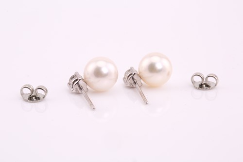 Lot 147 - A pair of diamond and pearl earrings, each...