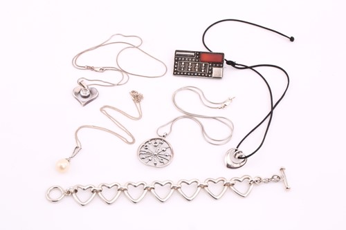 Lot 184 - A collection of silver jewellery. Including a...