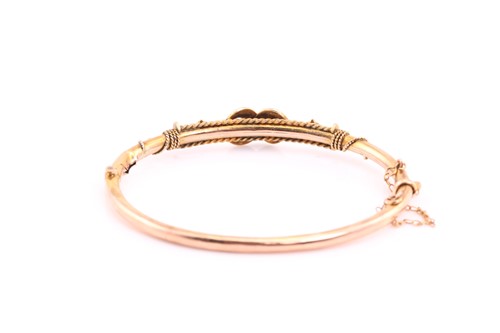 Lot 223 - A Victorian 9ct gold hinged bangle, with seed...