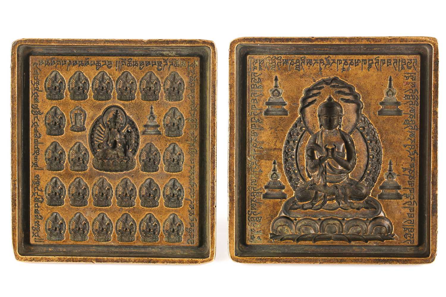 Lot 124 - Two Sino Tibetan bronze Buddha moulds, the...