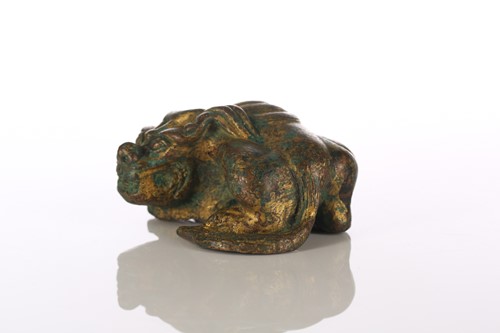 Lot 140 - A Chinese gilt bronze temple lion, the body...