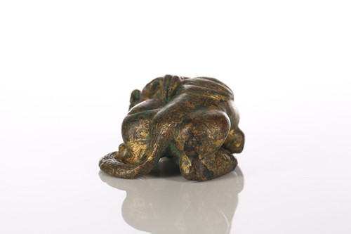 Lot 140 - A Chinese gilt bronze temple lion, the body...