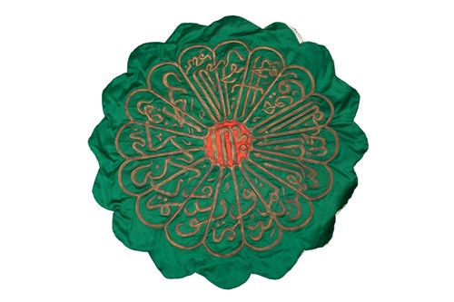 Lot 218 - An Islamic embroidered panel, the flower form...