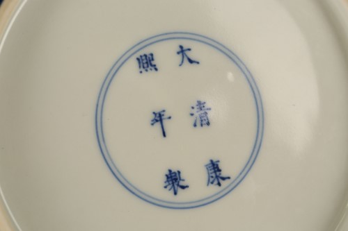 Lot 168 - A Chinese blue glazed dished plate, the deep...