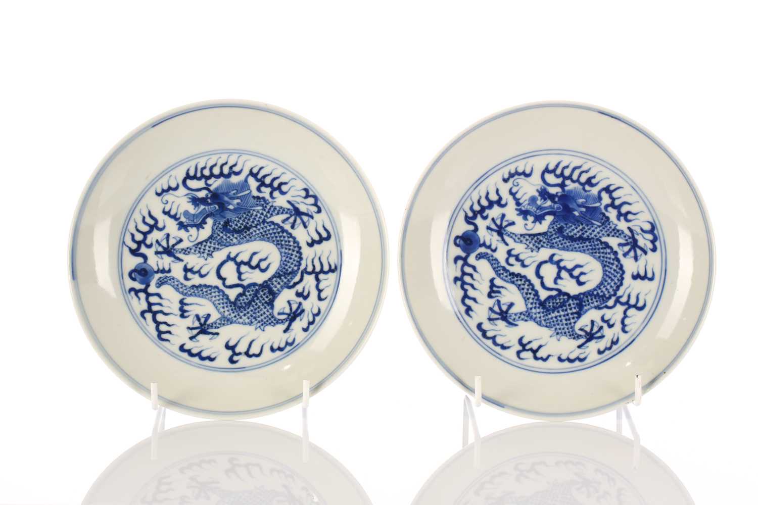 Lot 96 - A pair of Chinese blue & white dragon dishes,...