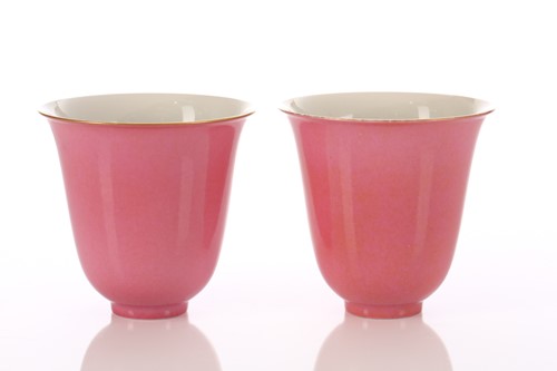 Lot 178 - A pair of Chinese peach bloom bell shape cups,...