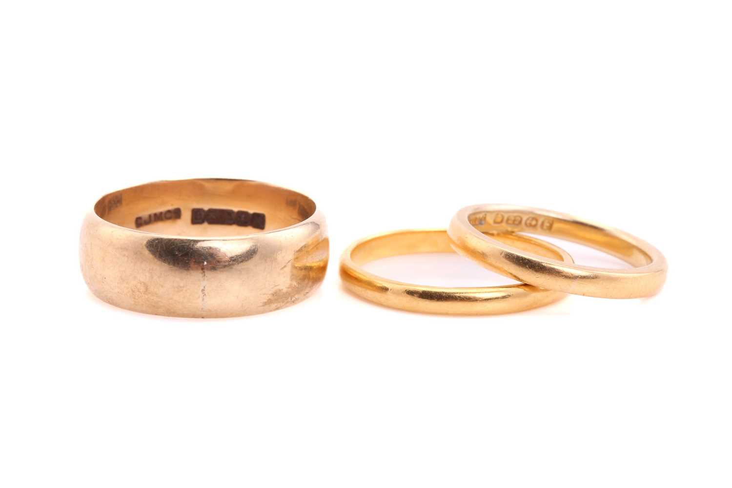 Lot 106 - Two 22ct gold wedding bands and a 9ct gold...