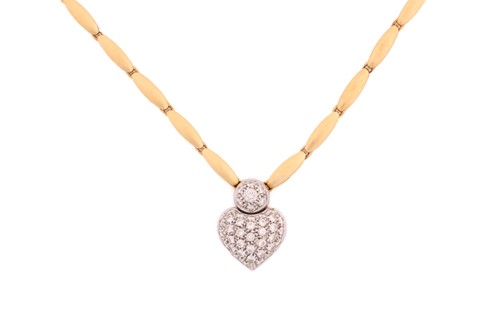 Lot 40 - An 18ct bi-coloured gold necklace with a heart...