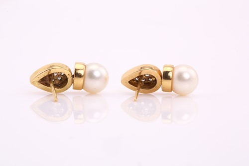 Lot 265 - A pair of pearl and diamond earrings, each...
