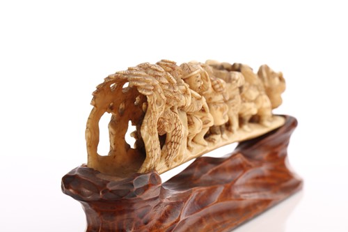 Lot 190 - A Japanese ivory okimono, Meiji period, carved...