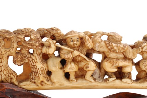 Lot 190 - A Japanese ivory okimono, Meiji period, carved...