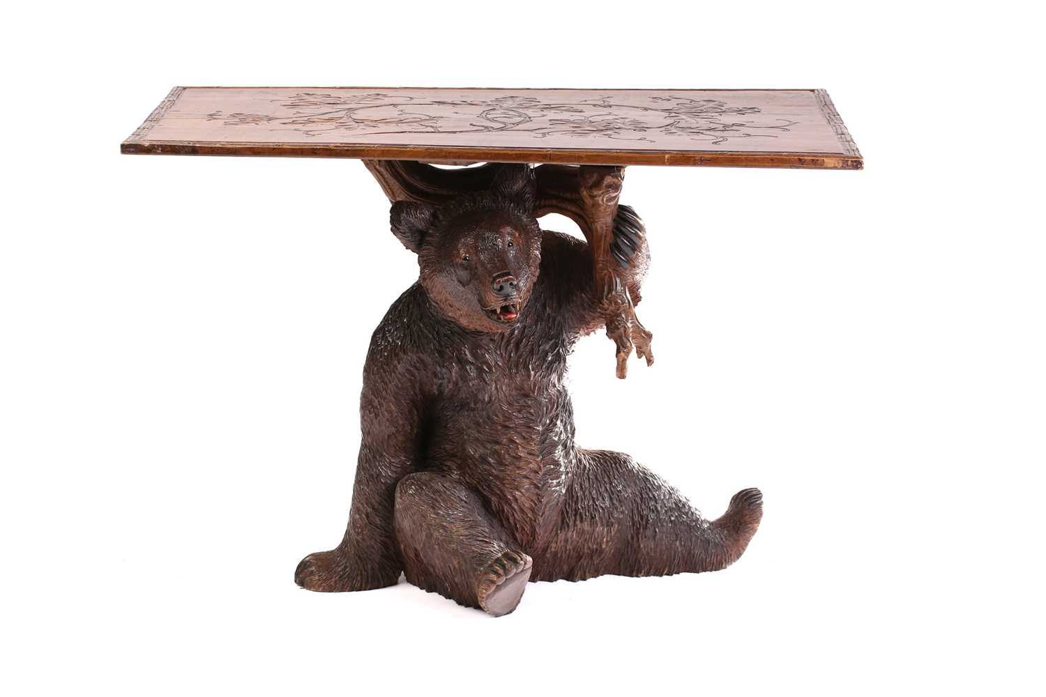 Lot 259 - A 20th-century "Black Forest" bear side table...