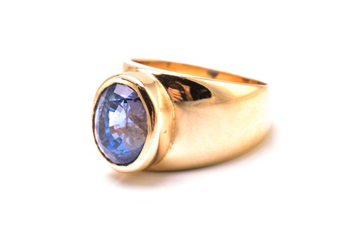 Lot 214 - A sapphire cocktail ring, featuring an oval...