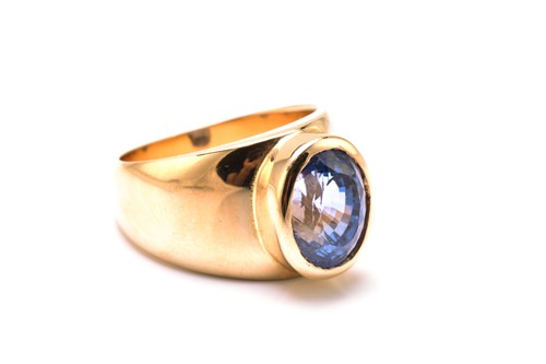 Lot 214 - A sapphire cocktail ring, featuring an oval...