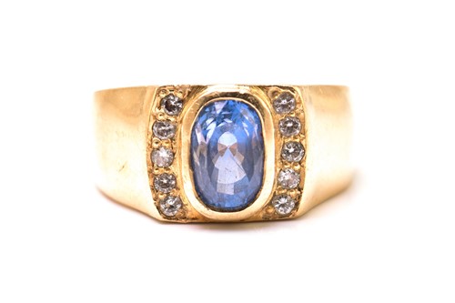 Lot 240 - A sapphire and diamond ring, comprises a...
