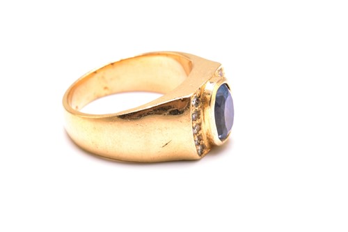Lot 240 - A sapphire and diamond ring, comprises a...