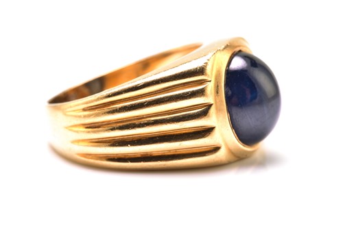 Lot 179 - A sapphire gypsy ring, featuring a high dome...