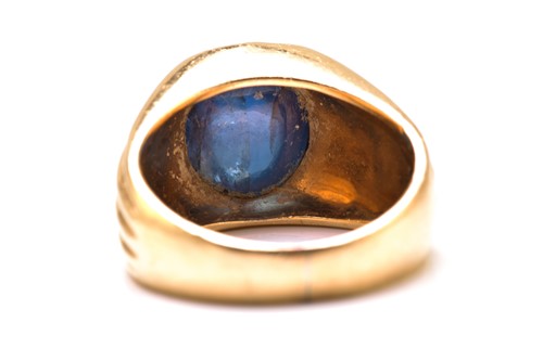 Lot 179 - A sapphire gypsy ring, featuring a high dome...