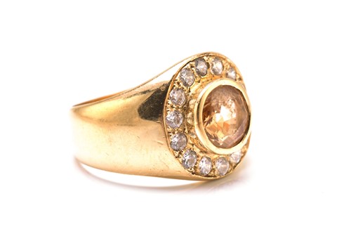 Lot 247 - A grossular garnet gypsy ring in yellow metal,...
