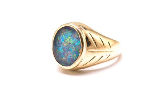 Lot 187 - An opal triplet ring, comprises an oval...