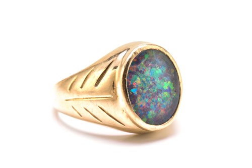 Lot 187 - An opal triplet ring, comprises an oval...