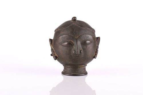 Lot 100 - An Indian cast bronze bust of the goddess...