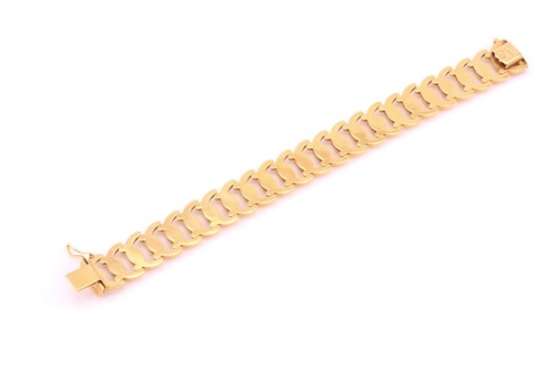 Lot 178 - A wide fancy link bracelet, with textured oval...