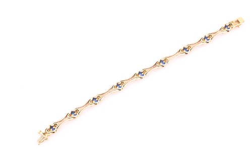 Lot 130 - A synthetic blue spinel bar link bracelet,...