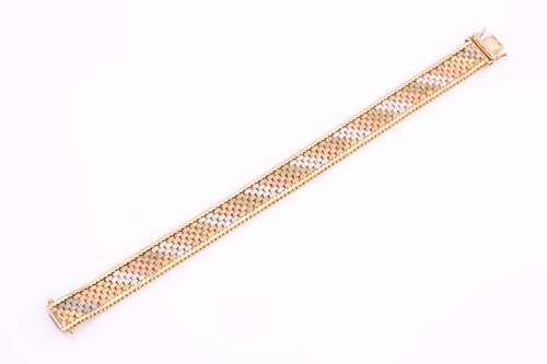 Lot 153 - A 9ct three-tone gold brick link bracelet,...