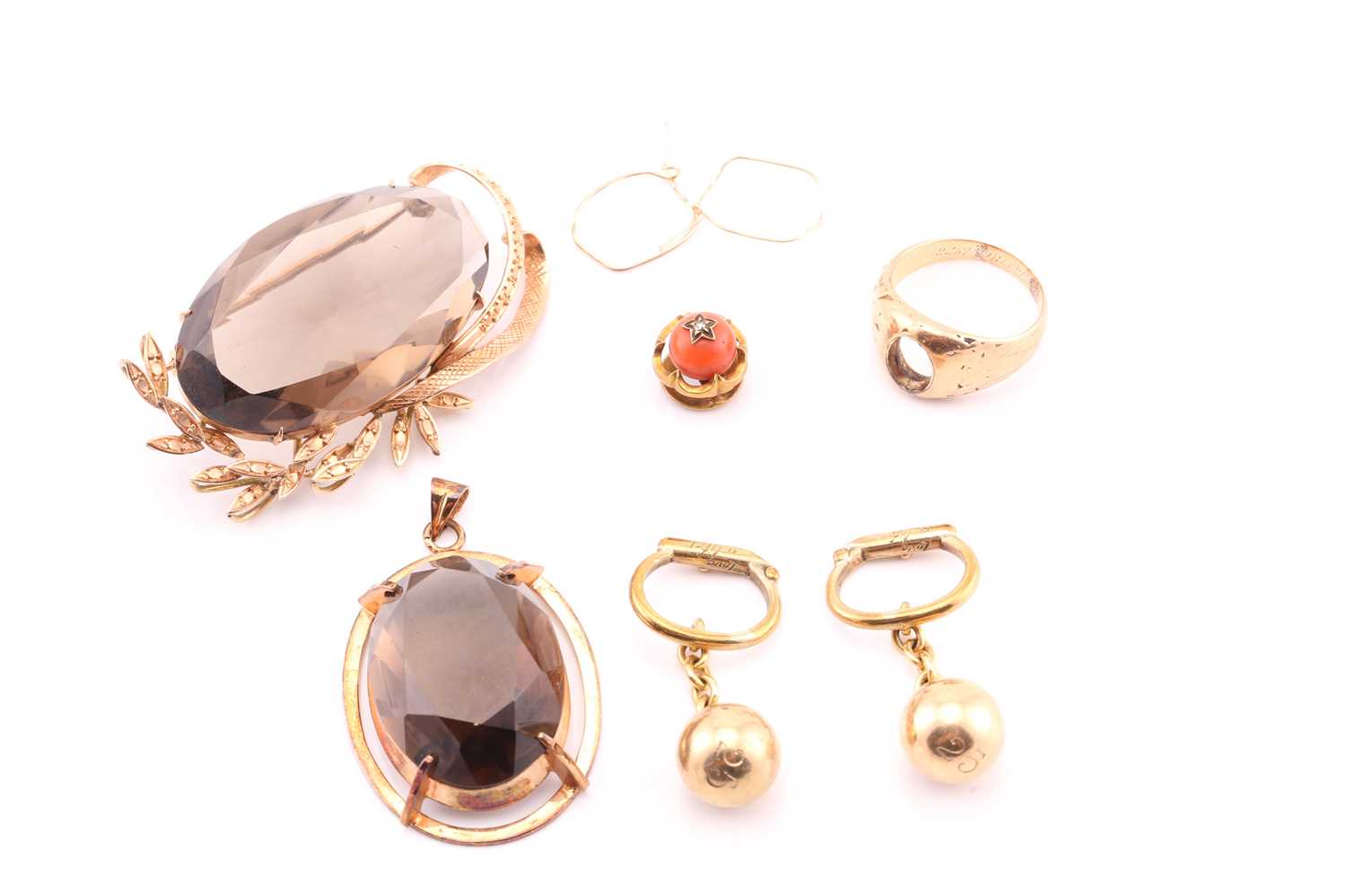 Lot 137 - A smoky quartz brooch, the large faceted oval...