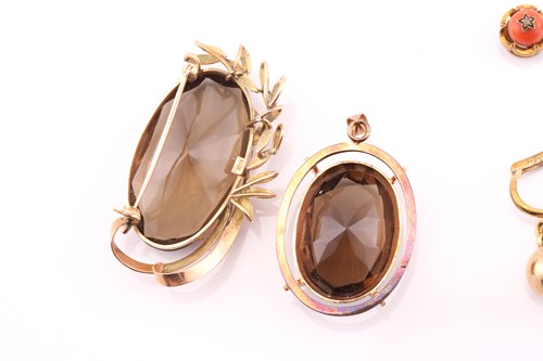Lot 137 - A smoky quartz brooch, the large faceted oval...