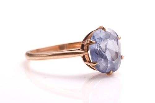 Lot 92 - A sapphire ring, with an oval sapphire in pale...