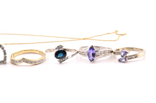 Lot 230 - A collection of gem-set rings and a pendant on...