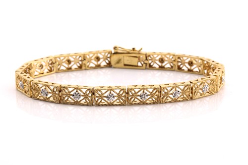 Lot 97 - A bracelet with diamond accents, featuring...