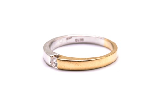 Lot 11 - A tension-set diamond ring, featuring a single...