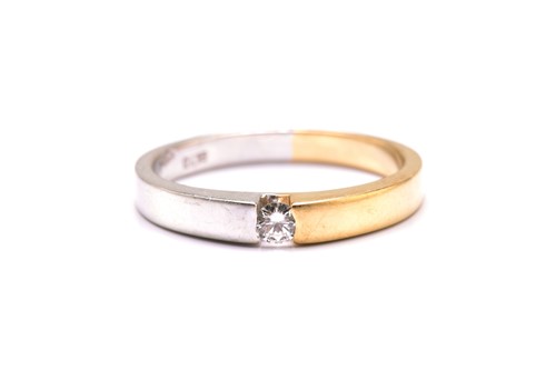 Lot 11 - A tension-set diamond ring, featuring a single...